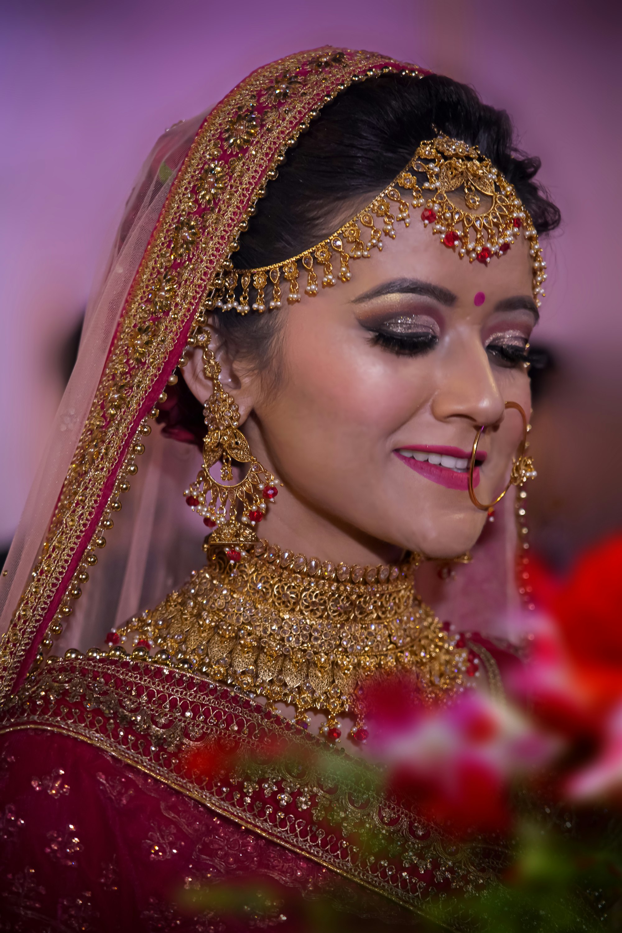 Priya in her maang tikka and bridal jewelry