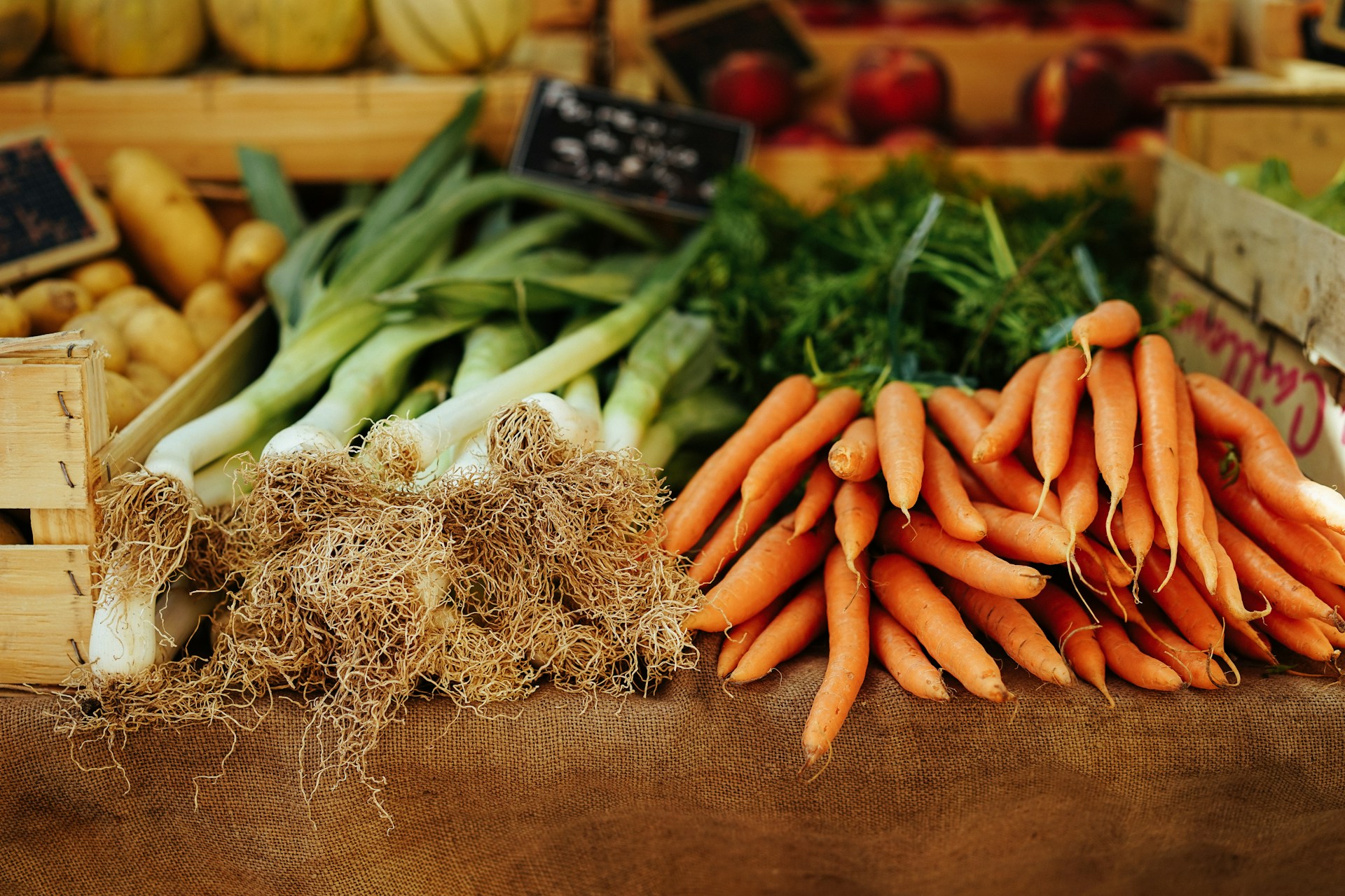 Crates of vegetables being unloaded at the kitchen door in the early morning