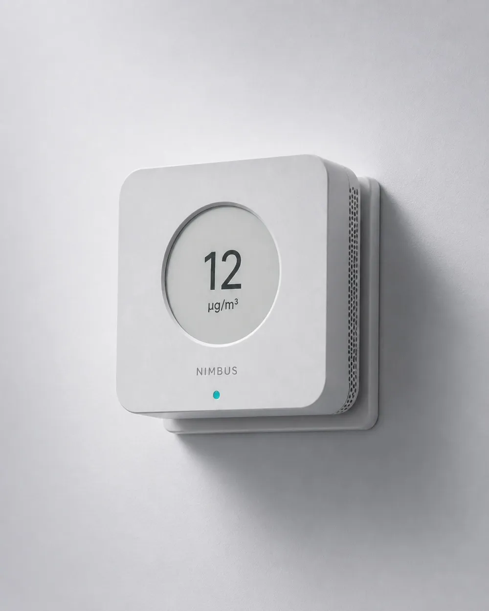Nimbus One mounted on its wall bracket in a hallway, seen from a low three-quarter angle.