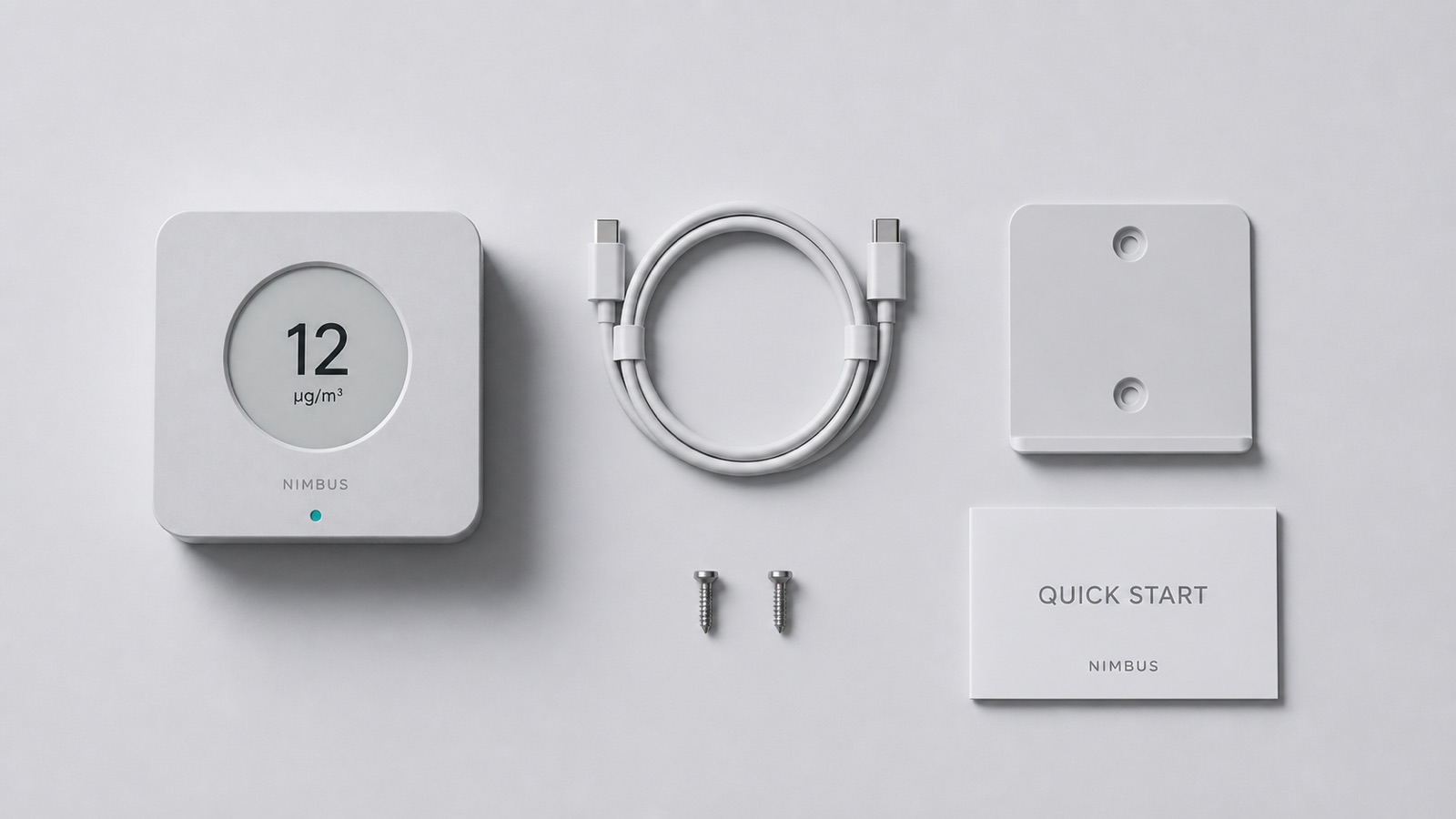 Top-down flatlay of the box contents: the monitor, a coiled USB-C cable, the wall bracket with two screws, and a folded quick-start card.