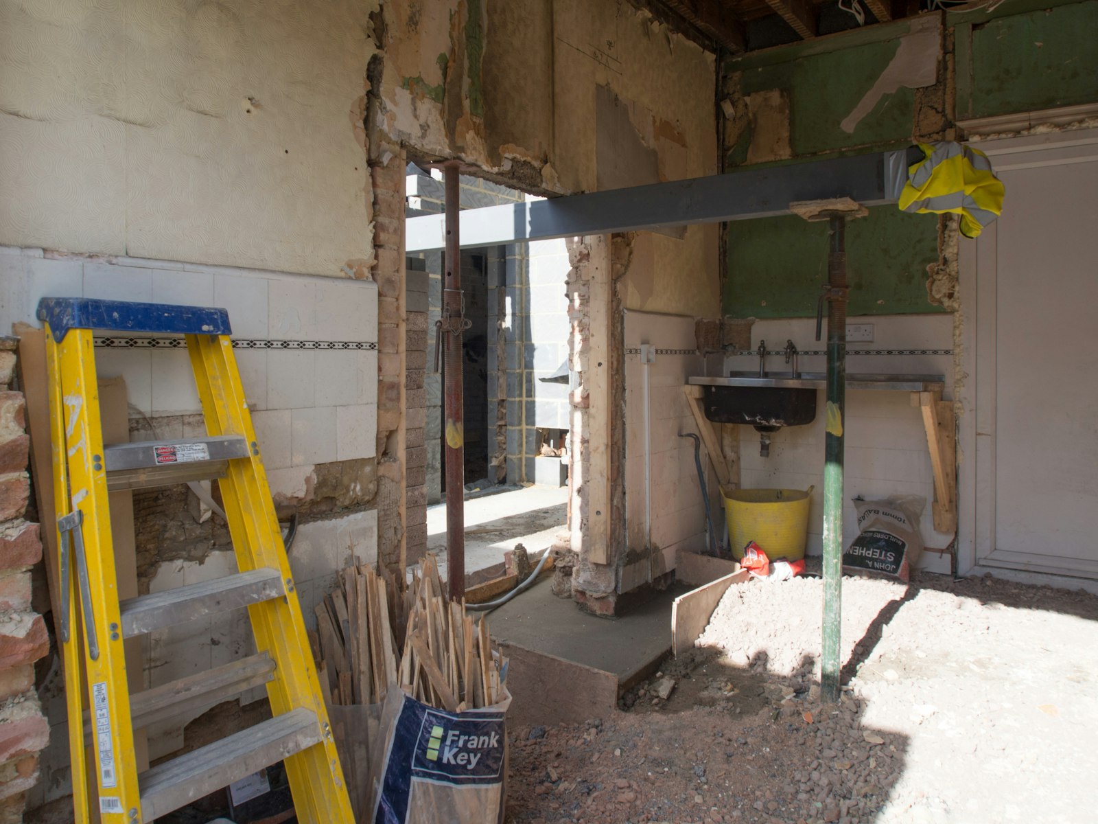Mid-build on a kitchen job: the wall out and a new beam on temporary posts