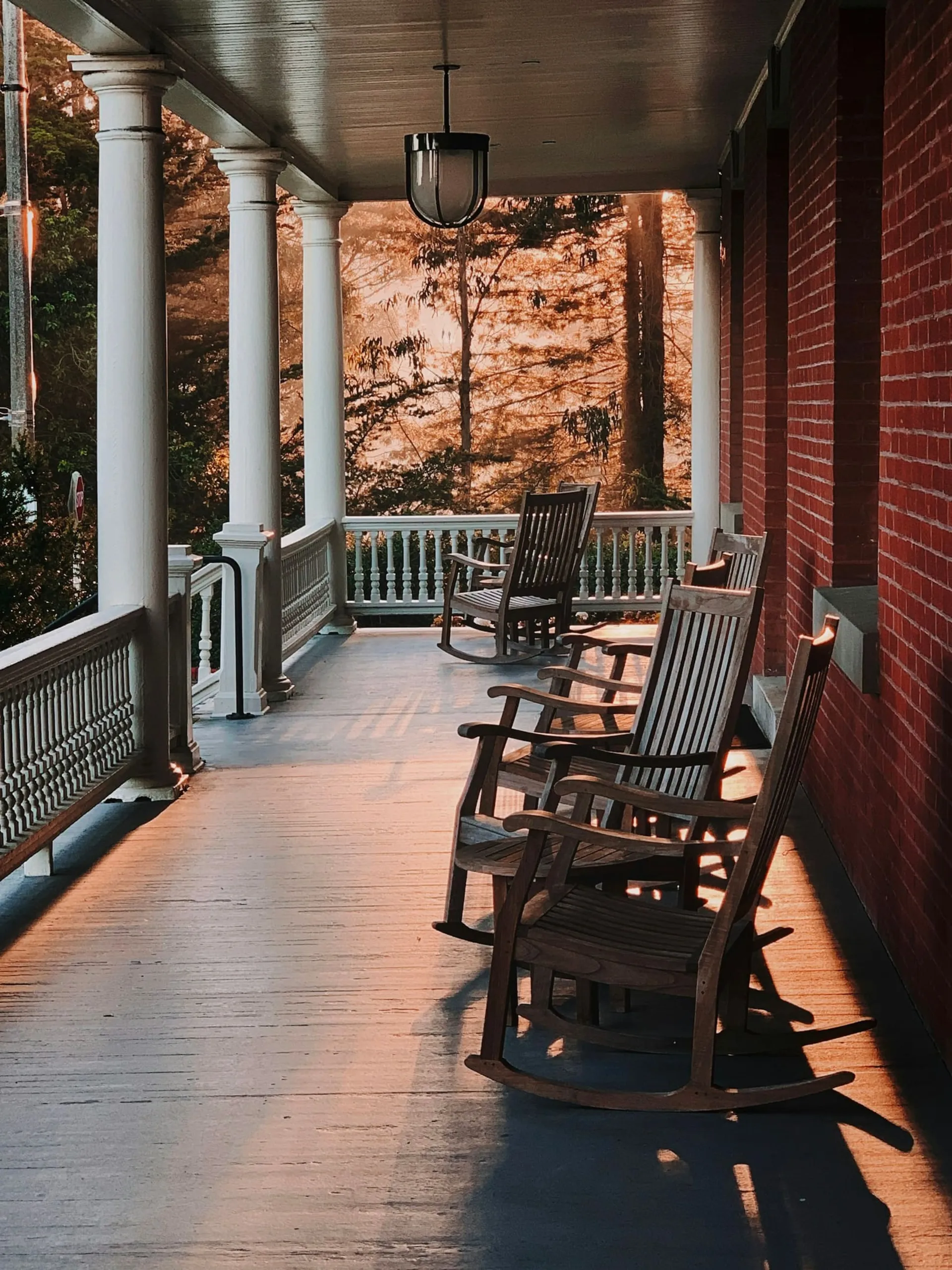 Rocking chairs on a long wooden porch