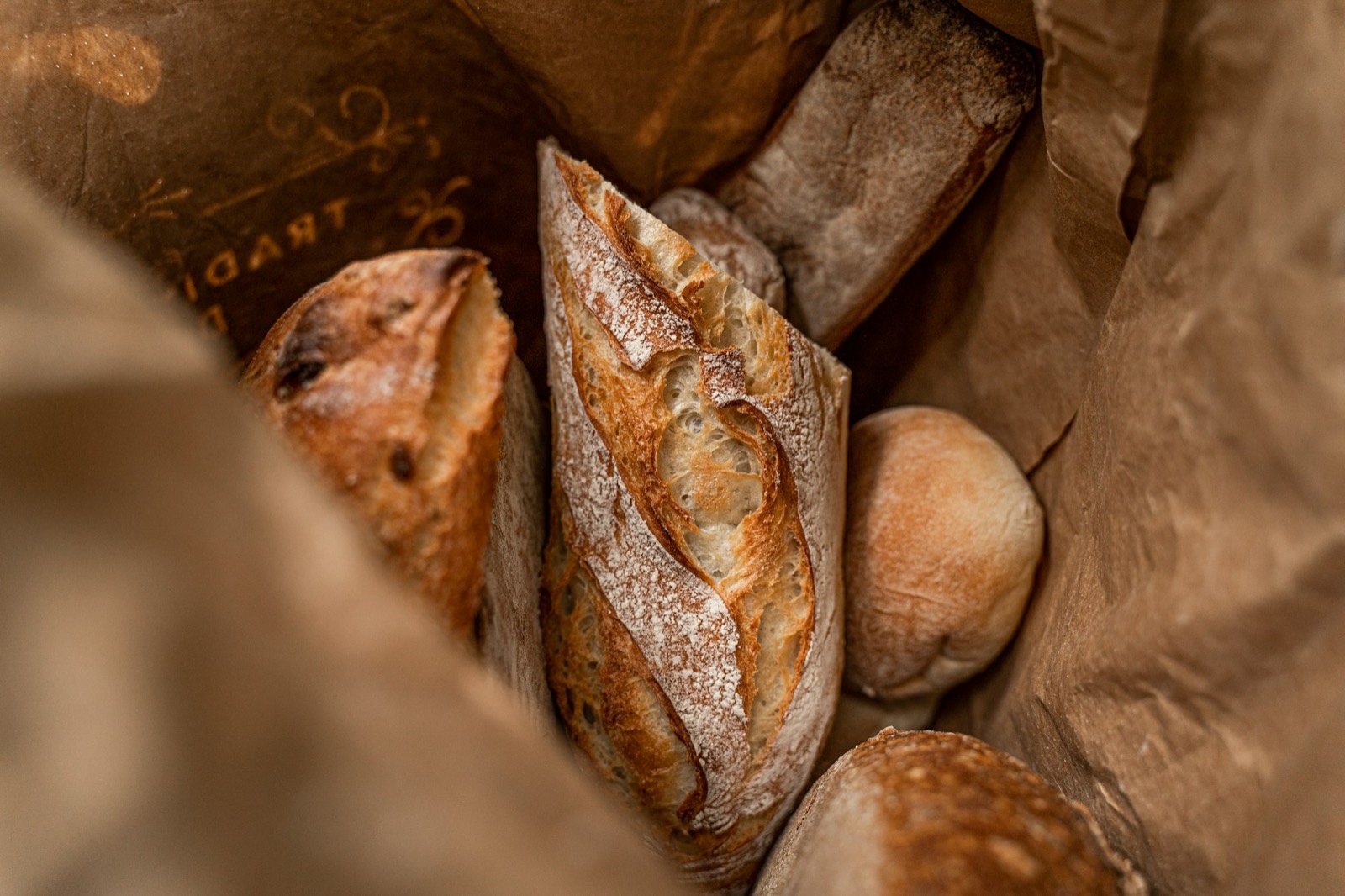 Baguettes and rolls in a paper bag